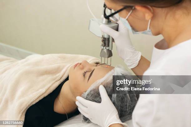 laser peeling procedure. - laser face stock pictures, royalty-free photos & images