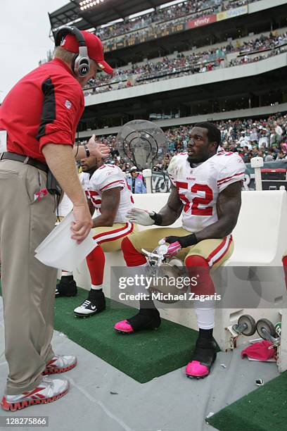 Linebackers Coach Jim Leavitt of the San Francisco 49ers talks with Patrick Willis during the game against the Philadelphia Eagles at Lincoln...