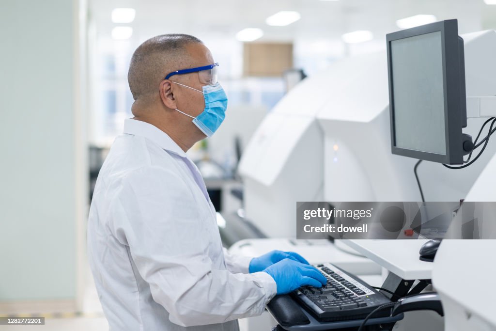 Scientist Working With Computer In Lab High-Res Stock Photo - Getty Images