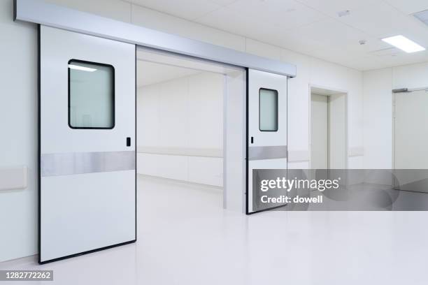 corridor in hospital - krankenhaus eingang stock-fotos und bilder