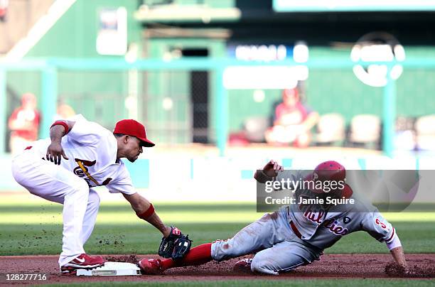 Hunter Pence of the Philadelphia Phillies is tagged out at second base by shortstop Rafael Furcal of the St. Louis Cardinals on a steal attempt in...