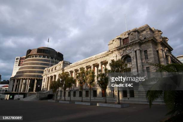the beehive and parliament house in wellington, new zealand. - parliament house new zealand stock pictures, royalty-free photos & images