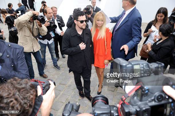 Nicole Richie and Joel Madden leave the Louis Vuitton Ready to Wear Spring / Summer 2012 show during Paris Fashion Week on October 5, 2011 in Paris,...