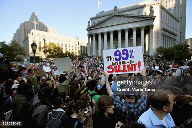 Protesters affiliated with the Occupy Wall Street movement rally in Foley Square before marching though Lower Manhattan on October 5, 2011 in New...