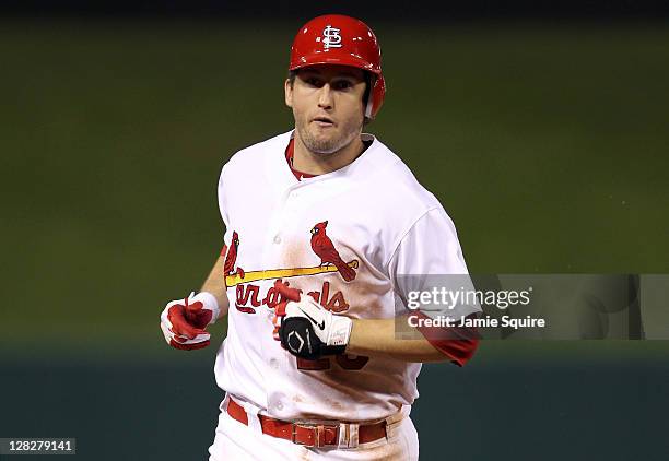 David Freese of the St. Louis Cardinals rounds the bases after hitting a two-run home run in the sixth inning off pitcher Roy Oswalt of the...