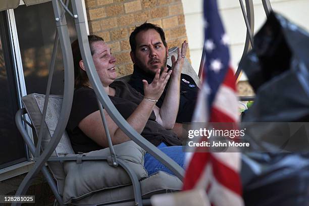 Brandie Barbiere tries to explain to her husband Dan Barbiere why their home was foreclosed upon on October 5, 2011 in Milliken, Colorado. Brandie...