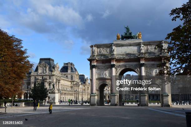 The arch of triumph Carousel is a monument dating from 1809 built under Napoleon Bonaparte and the Louvre Palace in Paris on October 27, 2020 in...