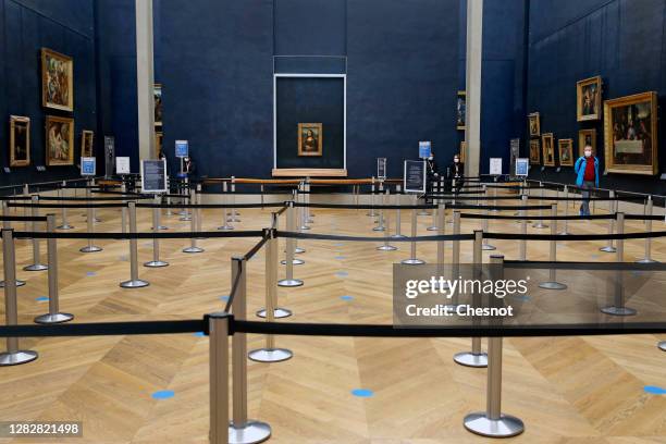 The painting of "Mona Lisa" also known as by Italian artist Leonardo Da Vinci is seen inside the deserted Louvre Museum as the novel coronavirus...