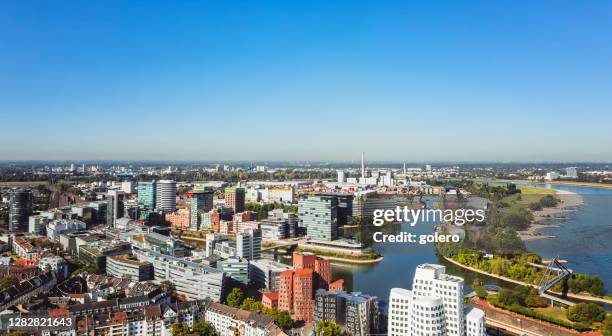 aerial view of düsseldorf media harbor with rhine river - medienhafen stock pictures, royalty-free photos & images