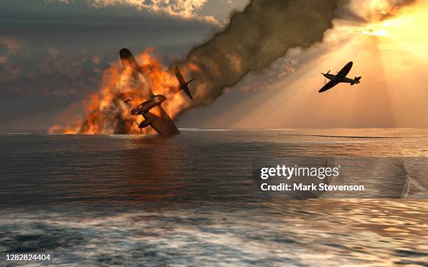 an raf spitfire shooting down a german henkel bomber - battle of britain stock illustrations