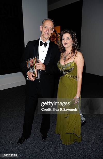 Film Director John Waters, and Maria Elena Tierno attend the "Warhol: Headlines" exhibition opening in the East Building at the National Gallery of...