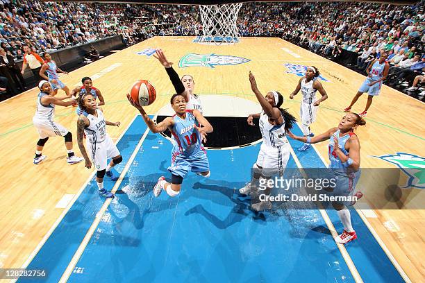 Lindsey Harding of the of the Atlanta Dream goes for the layup against Lindsay Whalen and Taj McWilliams-Franklin of the Minnesota Lynx in Game Two...