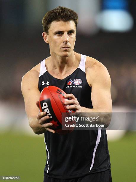 Academy Assistant Coach Matthew Lloyd looks to pass the ball during the 2011 AFL Draft Combine at Etihad Stadium on October 6, 2011 in Melbourne,...