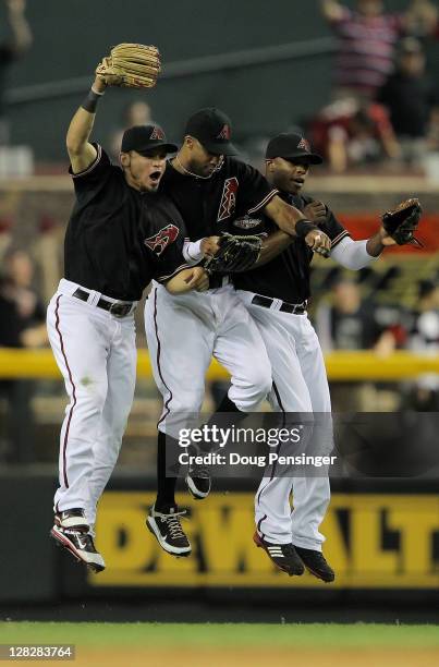 Gerardo Parra, Chris Young and Justin Upton of the Arizona Diamondbacks celebrate after their 10-6 win over the Milwaukee Brewers in Game Four of the...