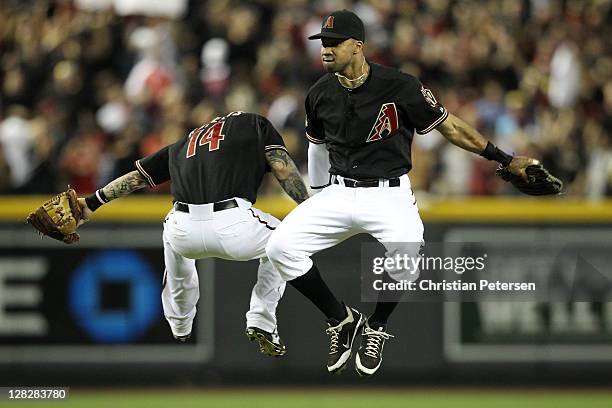 Chris Young and Ryan Roberts of the Arizona Diamondbacks celebrate after their 10-6 win over the Milwaukee Brewers in Game Four of the National...