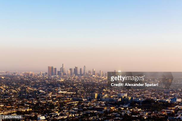 panoramic view of los angeles skyline at sunset, california, usa - la smog stock pictures, royalty-free photos & images