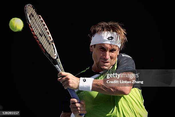 David Ferrer of Spain plays a backhand during the match against Matthew Ebden of Australia during the day four of the Rakuten Open at Ariake...