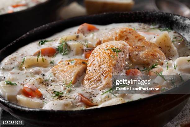 butter poached salmon chowder with potatoes, carrots and fresh dill - new england clam chowder stock pictures, royalty-free photos & images