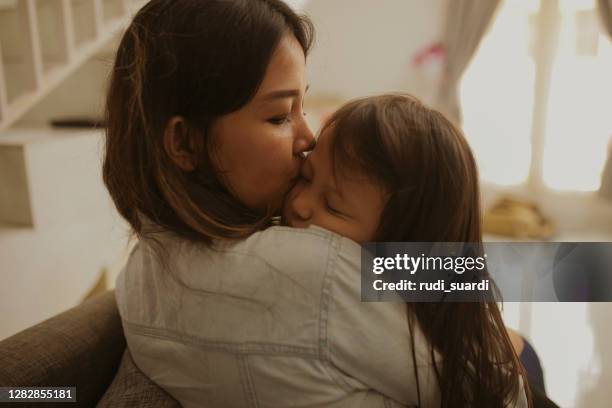 kid sleep on her mother arms - mom resting stock pictures, royalty-free photos & images