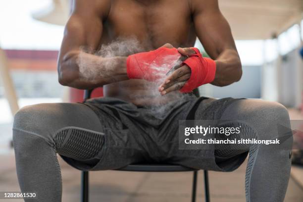 male fighter preparing hands  for fight. - boxing gloves stock pictures, royalty-free photos & images