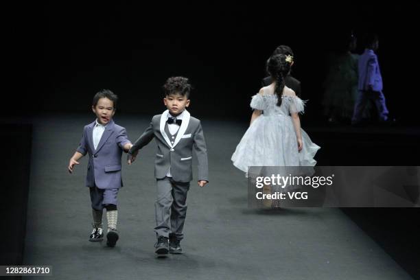 Child models showcase designs on the runway during MARVISIA & MAGMU collection show on day 6 of China Fashion Week 2021 Spring/Summer at 751D.PARK on...