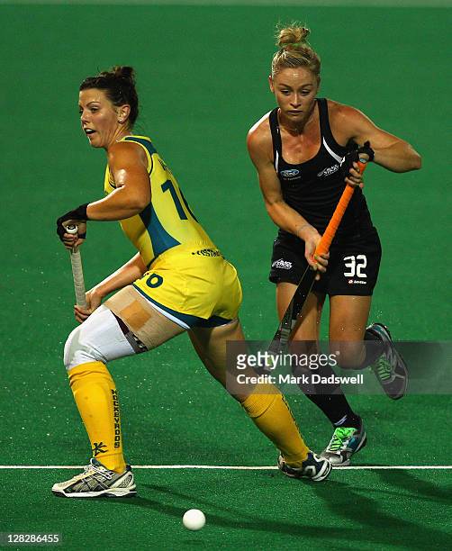 Kellie White of the Hockeyroos competes with Anita Punt of the Blacksticks during the Oceania Cup match between New Zealand and Australia at Hobart...