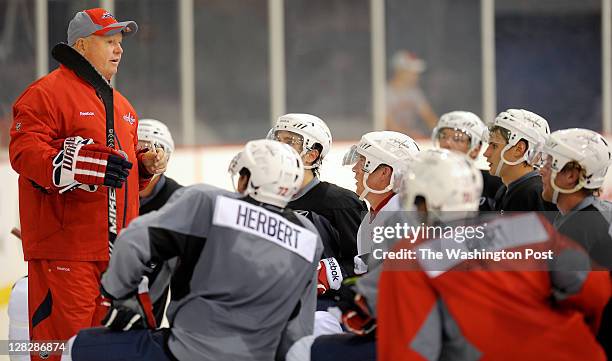 Capitals coach Bruce Boudreau, left, instructs players during the Washington Capitals 2011 development camp at Kettler Capitals Iceplex in Ballston...