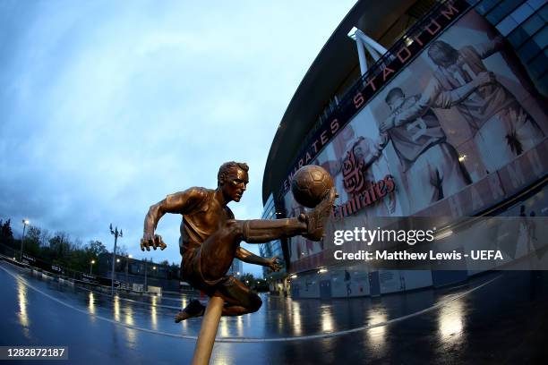 The statue of former Arsenal player Dennis Bergkamp is seen outside the stadium prior to the UEFA Europa League Group B stage match between Arsenal...