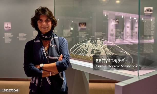 Curator Luísa Sampaio stands by a glass sculpture at the end of a press visit to the "René Lalique e a Idade do Vidro, Arte e Indústria" during the...