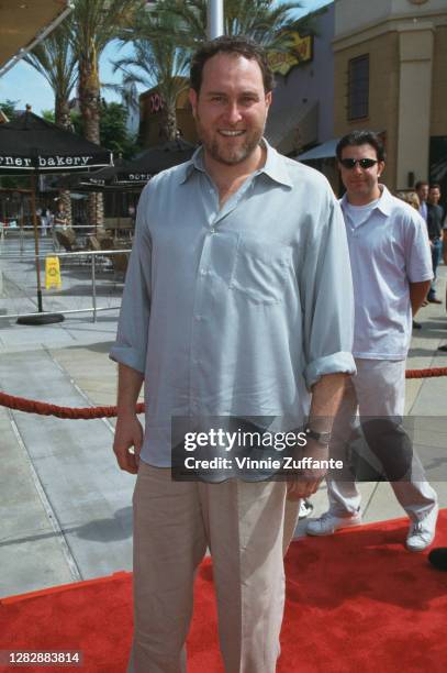 American film director Jon Turteltaub attends the premiere of 'The Kid', held at AMC 30 at the Block in Orange, California, 25th June 2000.