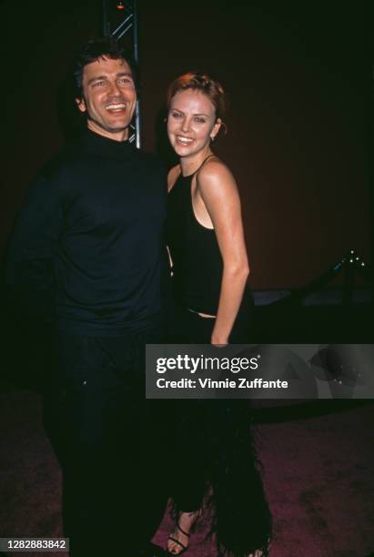 American singer-songwriter Stephan Jenkins and South African actress Charlize Theron attend Rock to Erase MS in Las Vegas, Nevada, 22nd May 1999.