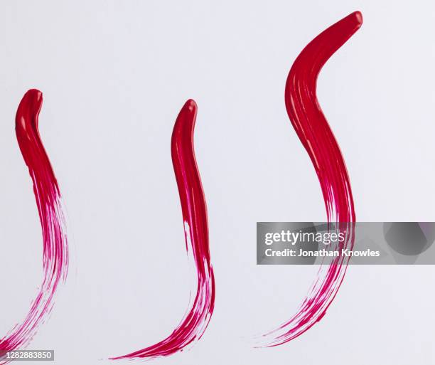 red lipstick streaks - red lipstick smudge stock pictures, royalty-free photos & images