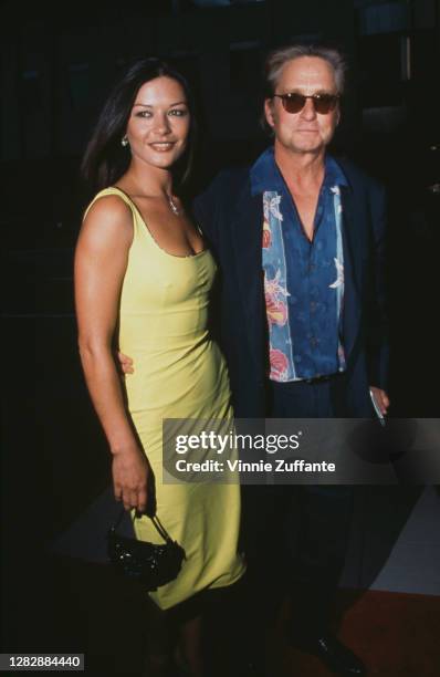 British actress Catherine Zeta-Jones and American actor Michael Douglas attend the premiere of 'The Muse' held at the Academy Theater in Beverly...