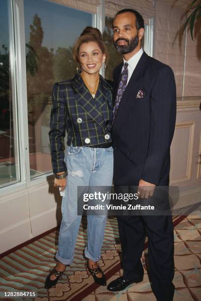 American singer and actress Vanessa Williams, wearing a green and blue check jacket, and her husband Ramon Hervey II attend the Soul Train Awards...