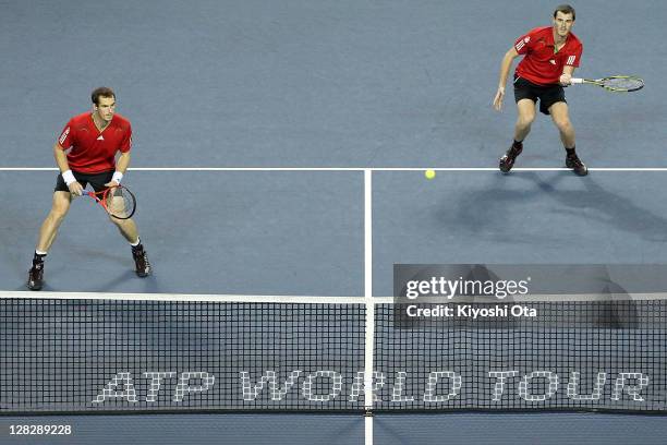 Andy Murray and Jamie Murray of Great Britain play in their quarter final doubles match against Tatsuma Ito and Kei Nishikori of Japan during day...