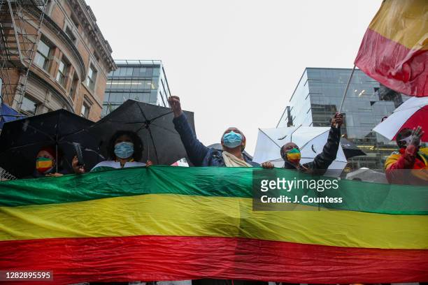 Activists from the Ethiopian community march from the White House to the State Department in protest of President Donald Trump's comments on Ethiopia...