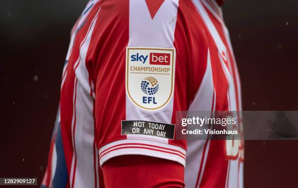 The Sky Bet Championship logo on the sleeve of a Stoke City player with the anti-racist message "u2018 not today or any day"u2019 during the Sky Bet...