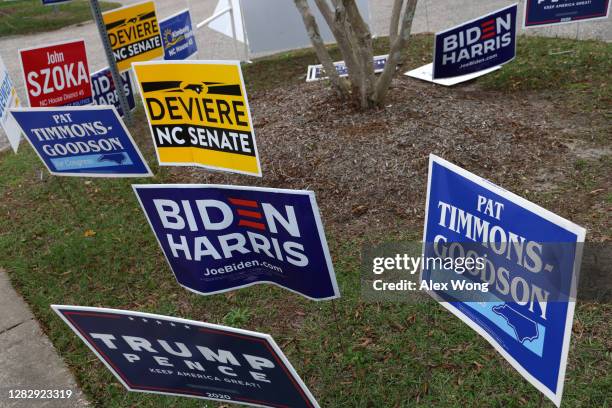 Campaign signs are displayed outside an early voting location at Massey Hill Recreation Center & Park on October 29, 2020 in Fayetteville, North...