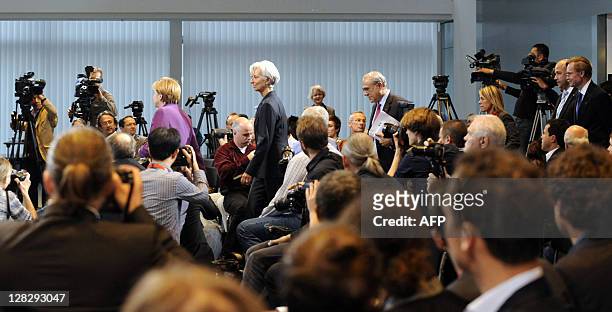 German Chancellor Angela Merkel arrives to give a press conference followed by International Monetary Fund Managing Director Christine Lagarde , Head...