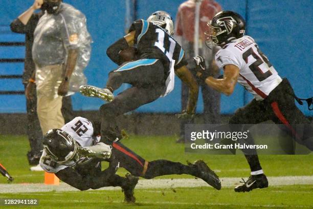 Robby Anderson of the Carolina Panthers is tackled by Isaiah Oliver and A.J. Terrell of the Atlanta Falcons during the third quarter at Bank of...