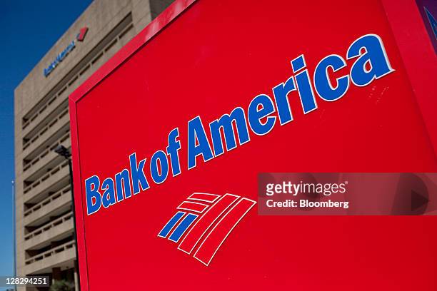 The Bank of America Corp. Logo is displayed in front of a branch in Galveston, Texas, U.S., on Saturday, Oct. 1, 2011. Bank of America Corp. Should...