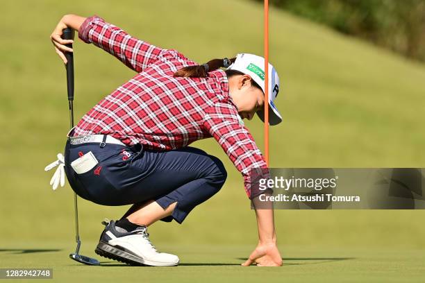 Hinako Shibuno of Japan picks the ball up after making a hole-in-one 8th hole during the first round of the Hisako Higuchi Mitsubishi Electric Ladies...