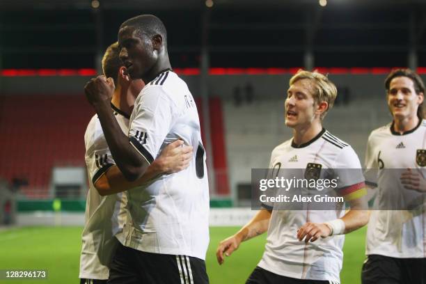 Peniel Mlapa of Germany celebrates his team's first goal with team mates during the UEFA Under-21 Euro qualifying match between Germany and Bosnia...