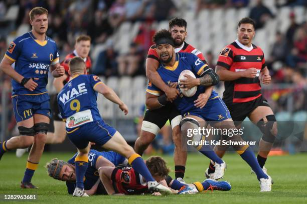 Nasi Manu of Otago is tackled by Billy Harmon of Canterbury during the round 8 Mitre 10 Cup match between Canterbury and Otago at Orangetheory...