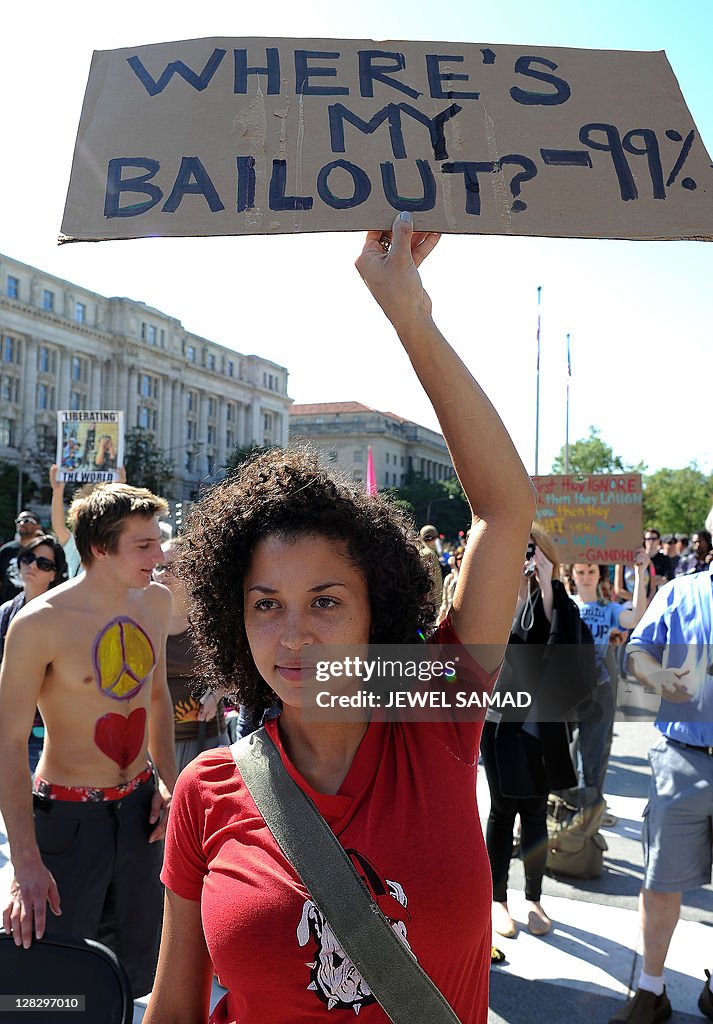 Compamy Protests Anti-corporate protesters display banners and placards as they take ...