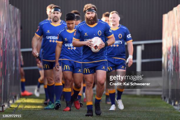 Captain Liam Coltman of Otago leads his team onto the field prior to the round 8 Mitre 10 Cup match between Canterbury and Otago at Orangetheory...