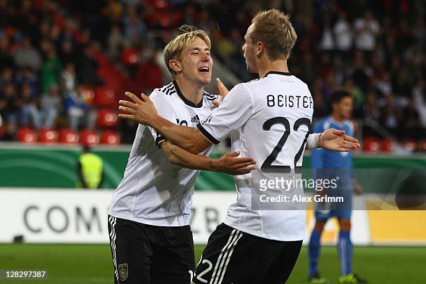 Lewis Holtby of Germany celebrates his team's third goal with team mate Maximilian Beister during the UEFA Under-21 Euro qualifying match between...