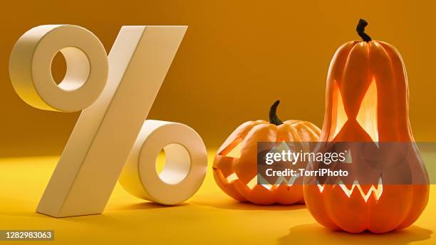 halloween sale. jack o lanterns on orange background - percentage sign stock-fotos und bilder