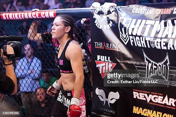 Cristiane "Cyborg" Santos stands in the cage before the Women's Featherweight Championship bout against Marloes Coenen at the Strikeforce Miami event...