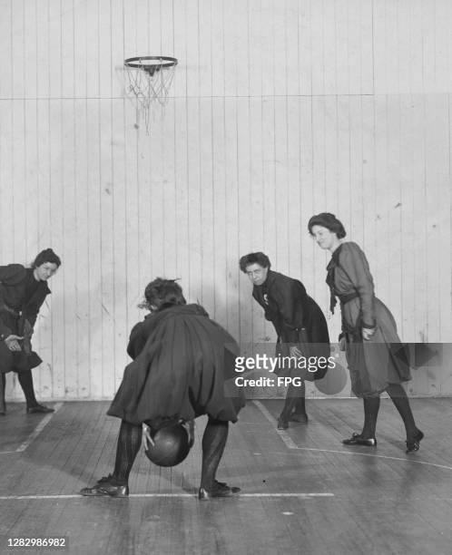An all-female team playing a basketball match, US, 1899.
